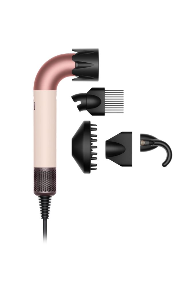 pink dyson hairdryer with four attachments 