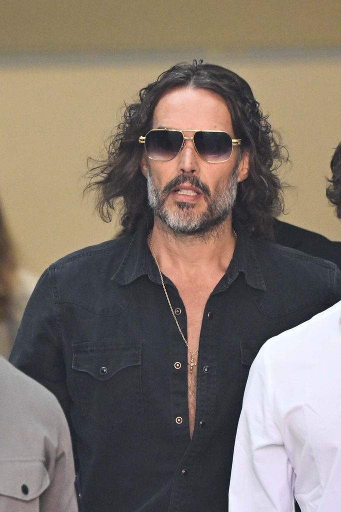 Russell Brand arrives at Westminster Magistrates' Court to face charges of rape, indecent assault