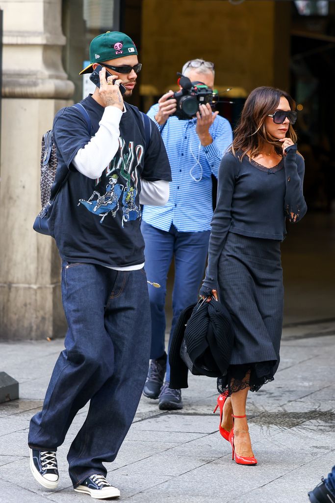 Romeo Beckham and Victoria Beckham walking streets