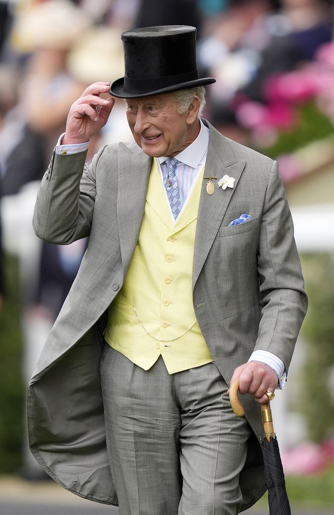 King Charles tips his hat to the crowd at Royal Ascot