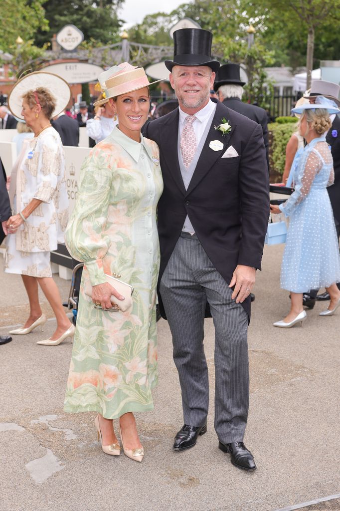 Zara Tindall in a pastel green floral midi dress and ombré hat at Royal Ascot standing next to Mike Tindall