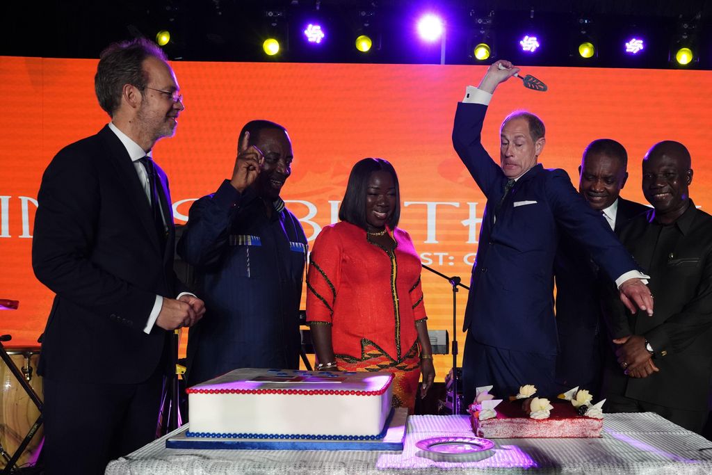 The Duke of Edinburgh cuts a cake as Elizabeth Ofosu-Adjare, Minister for Trade and British High Commissioner to Ghana Dr Christian Rogg look on during an annual event to celebrate King Charles III's birthday and the relationship between UK and Ghana at the British High Commissioner's Residence in Accra, Ghana