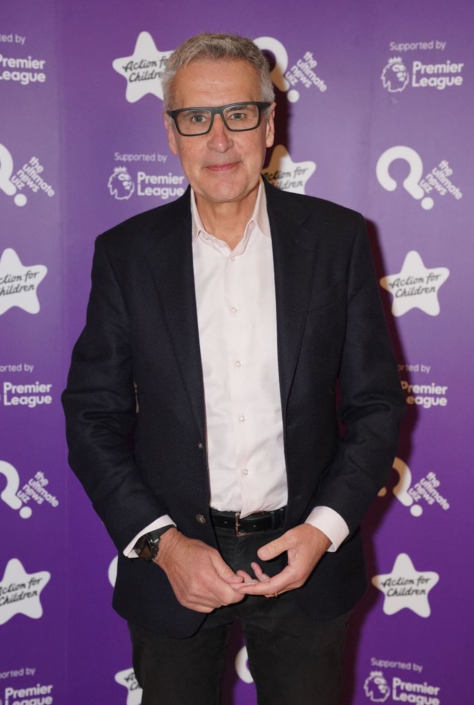 dermot murnaghan posing for photo in smart suit and glasses