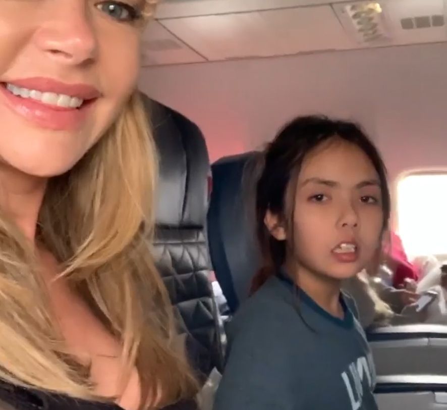 Denise Richards and a young girl on a plane