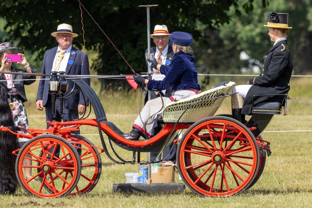 Duchess Sophie puts glass back on post during carriage driving event