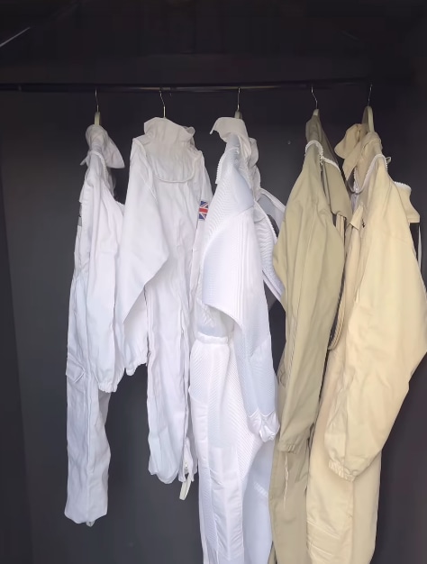 Stacey Solomon photo showing inside her garden shed with beekeeping suits on hangers