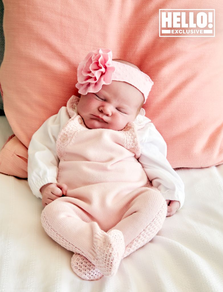 Stuart and Francis' baby girl looks perfect with her pink headband