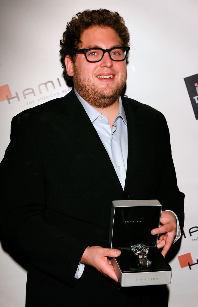 jonah hill suit holding award