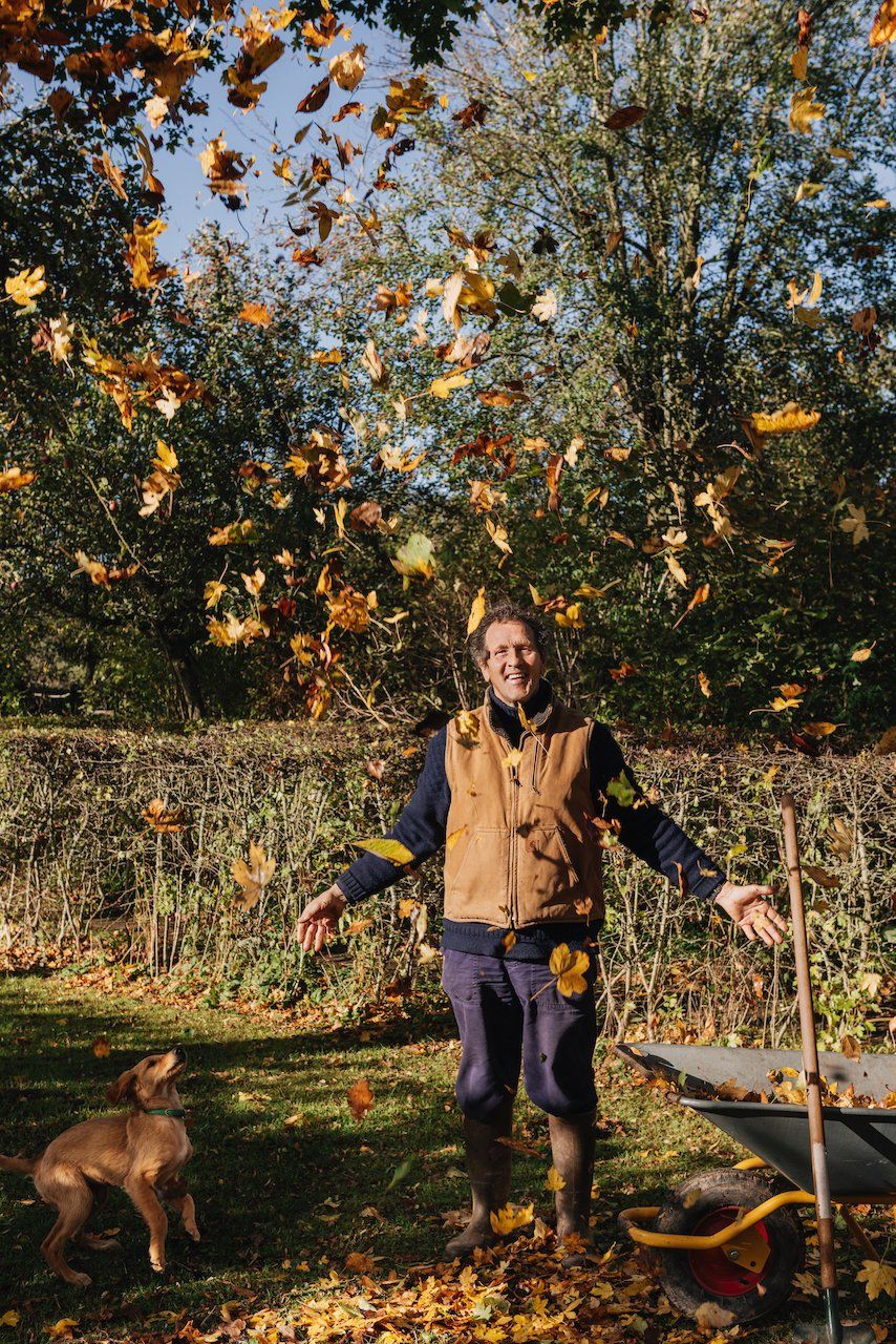 Monty Don throwing leaves up in glee