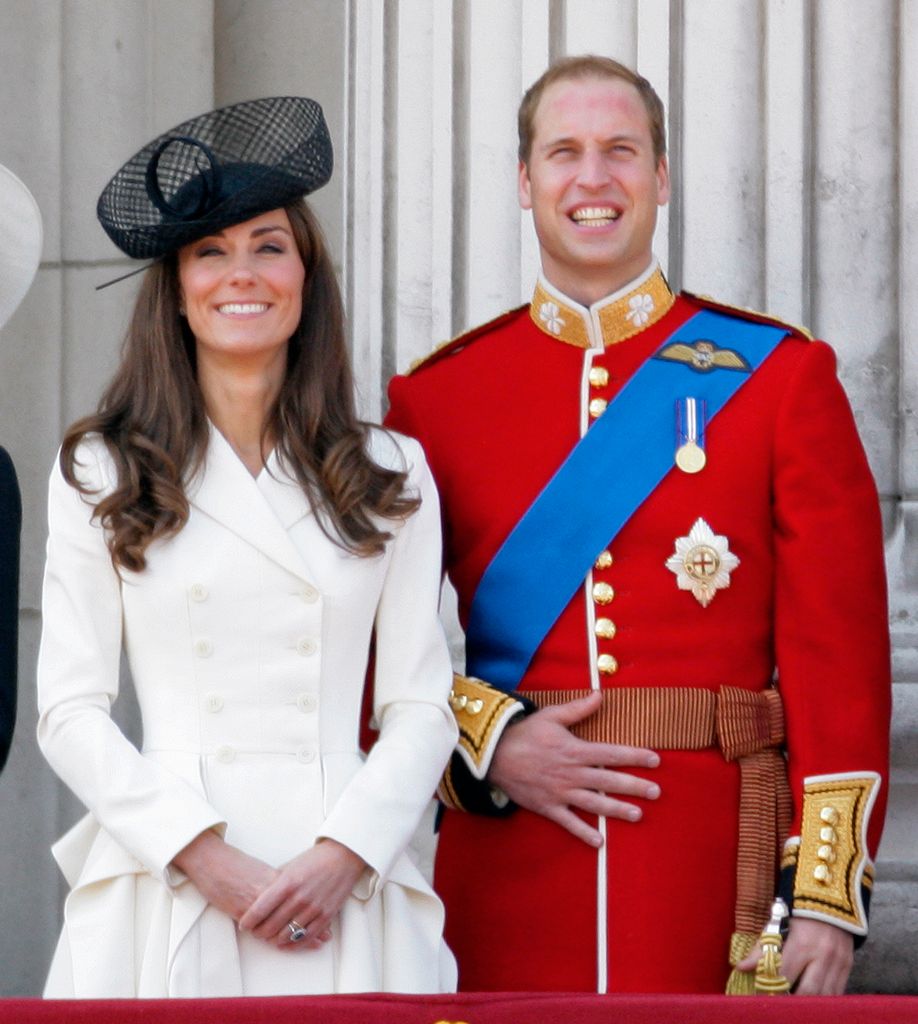 Catherine, Duchess of Cambridge and Prince William, Duke of Cambridge stand on the balcony of Buckingham Palace after the Trooping the Colour Parade on June 11, 2011 in London, England. 