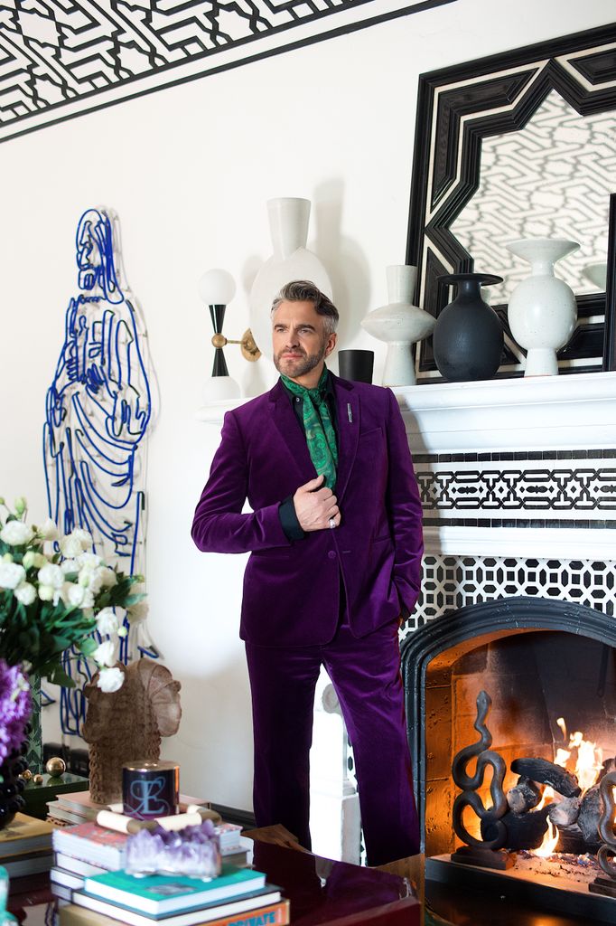Martyn Lawrence posing in Martyn Lawrence Bullard's Hollywood residence 