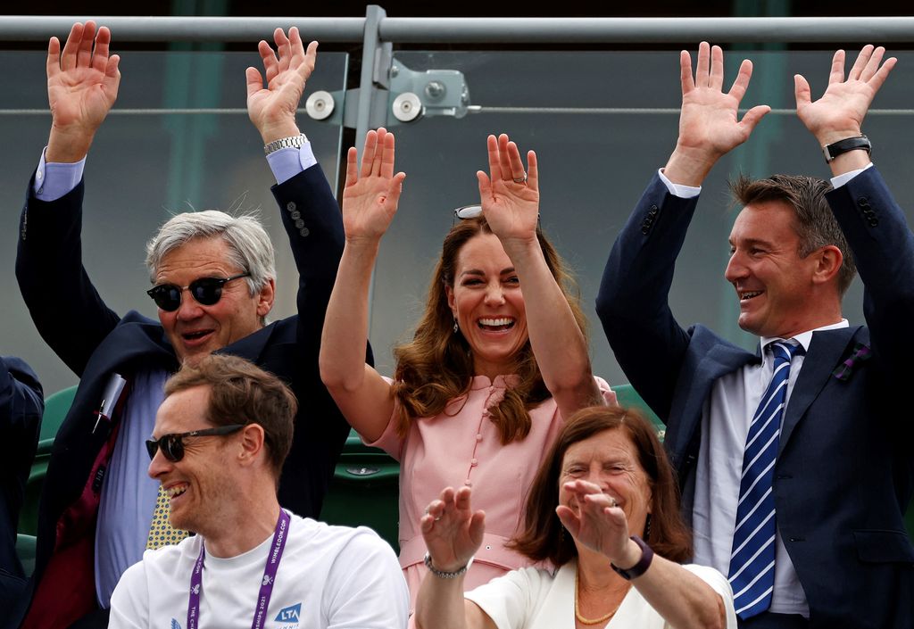 Kate and Michael Middleton doing the wave at Wimbledon