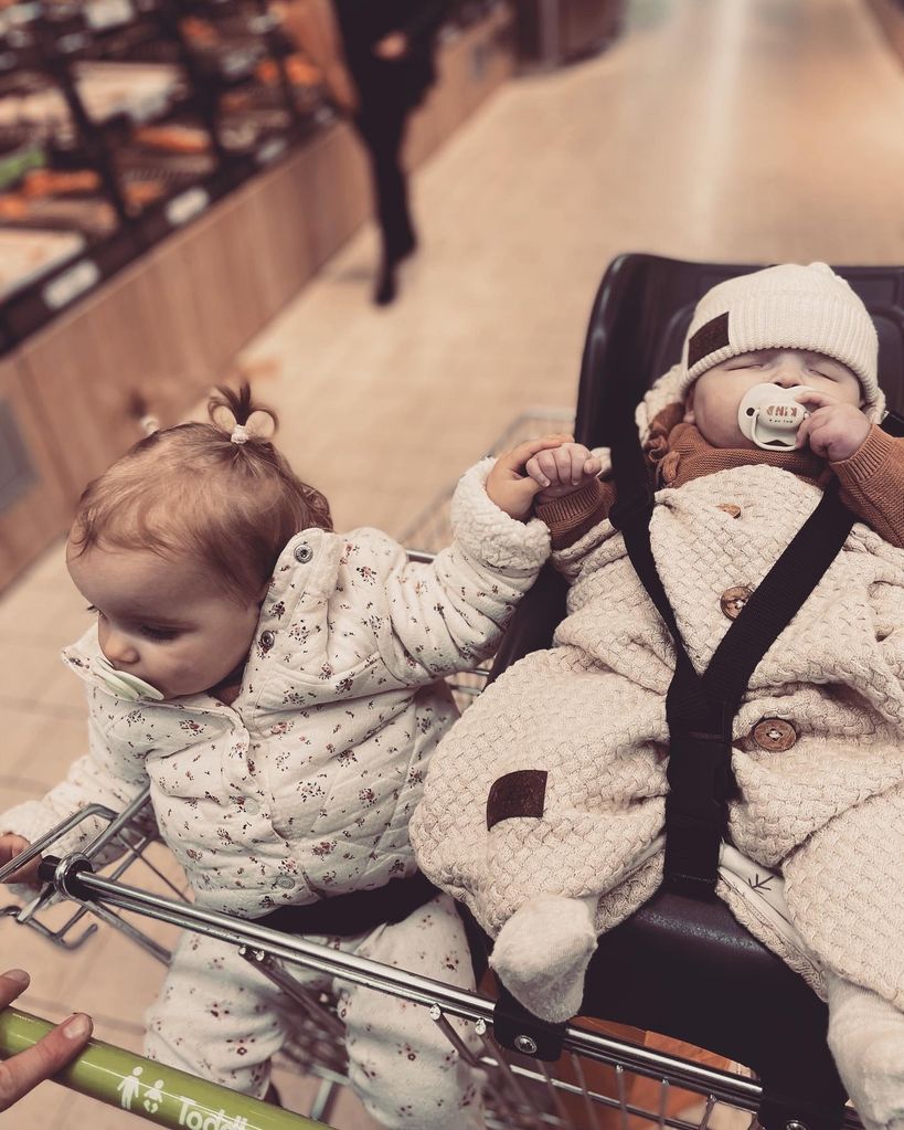 Margot with sister in trolley