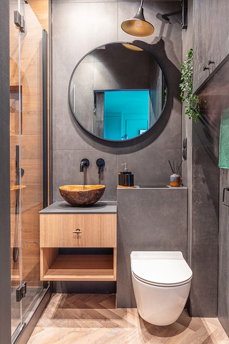 Small dark bathroom with storage