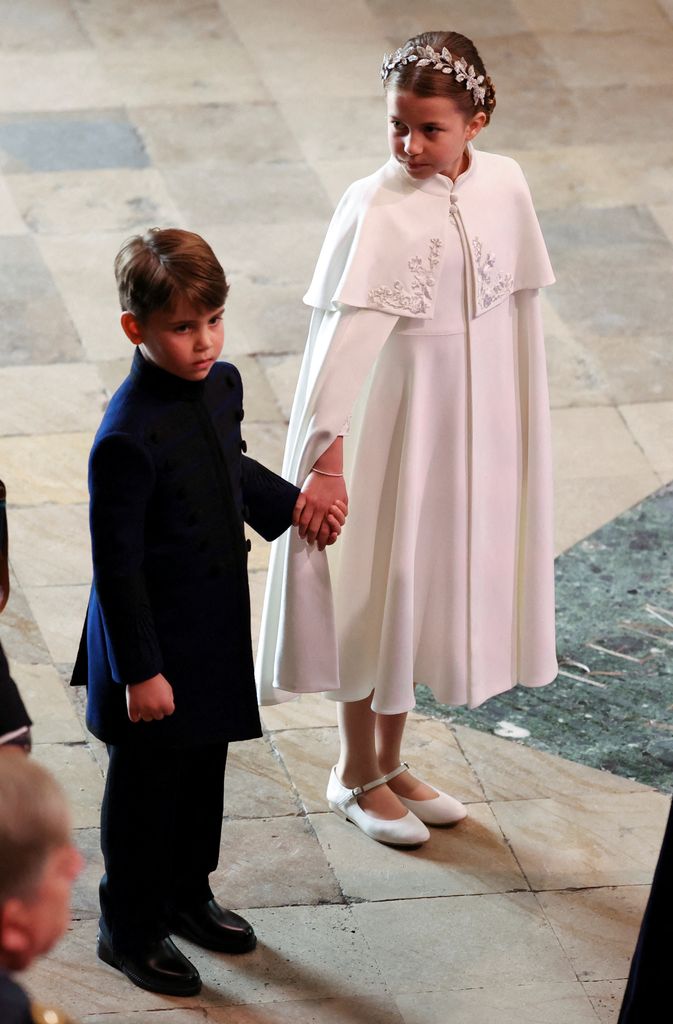 Princess Charlotte protectively held her brother's hand
