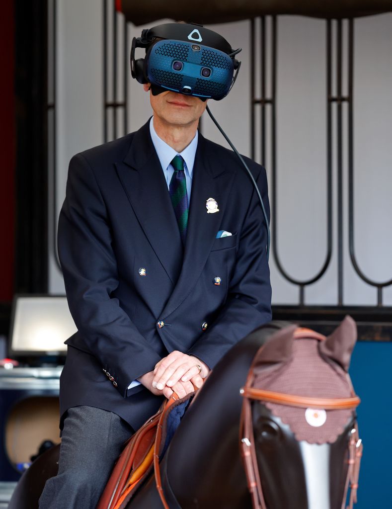 Prince Edward tries a virtual reality horse racing simulator 