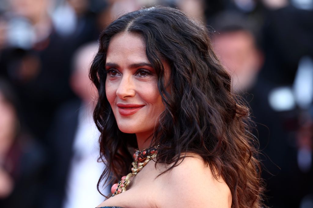  salma hayek. on red carpet with wavy hair