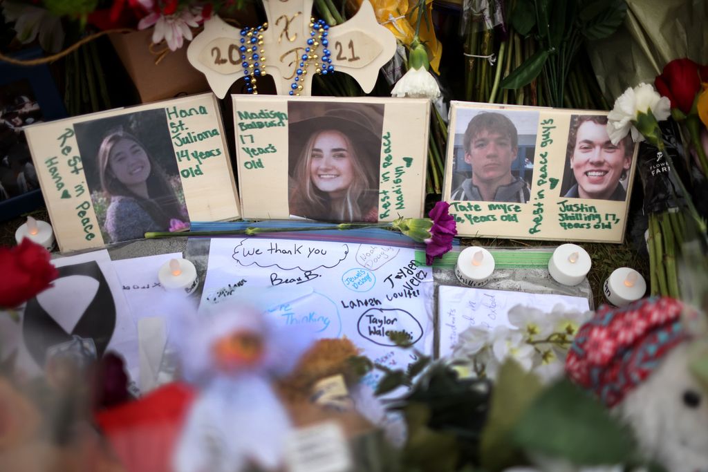 A memorial outside of Oxford High School continues to grow on December 03 2021 in Oxford, Michigan.  Four students were killed and seven others injured on November 30, when student Ethan Crumbley allegedly opened fire with a pistol at the school. Crumbley has been charged in the shooting. One or both of his parents are expected to be charged today