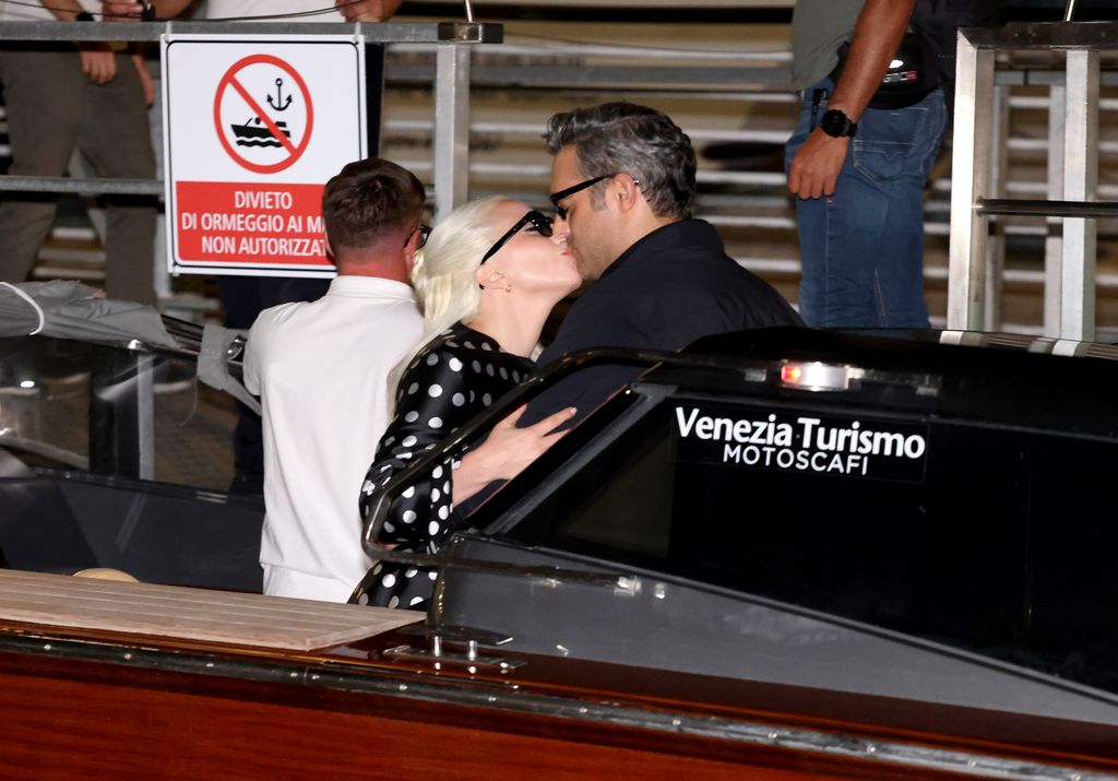  Lady Gaga and Michael share a sweet kiss