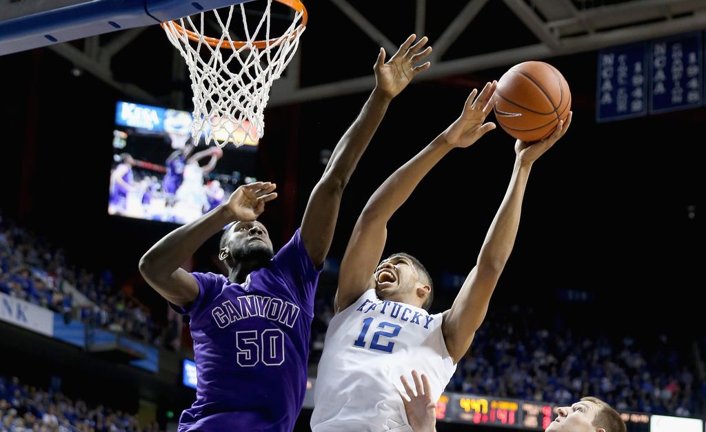 Karl played college basketball at the University of Kentucky