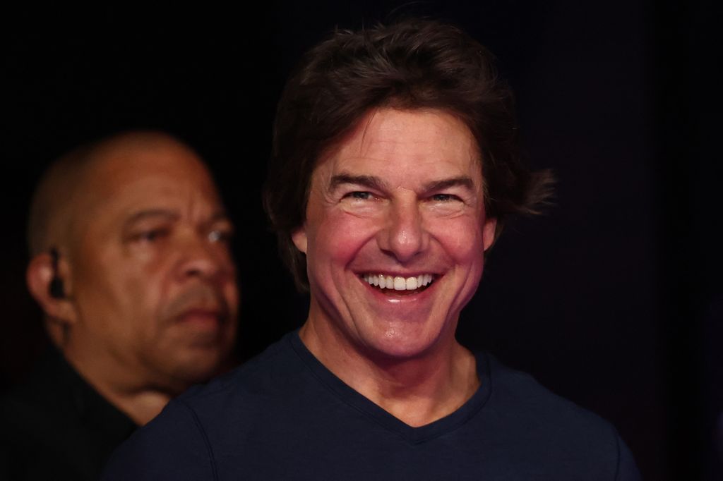 US' actor Tom Cruise reacts as he attends the closing ceremony of the Paris 2024 Olympic Games at the Stade de France, in Saint-Denis, in the outskirts of Paris, on August 11, 2024.