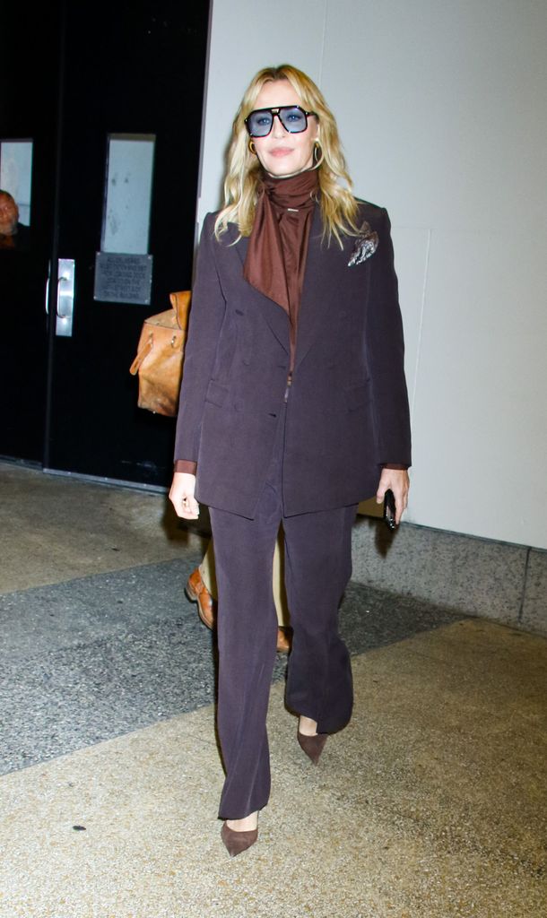 Connie Nielsen paired retro sunglasses with her trouser suit