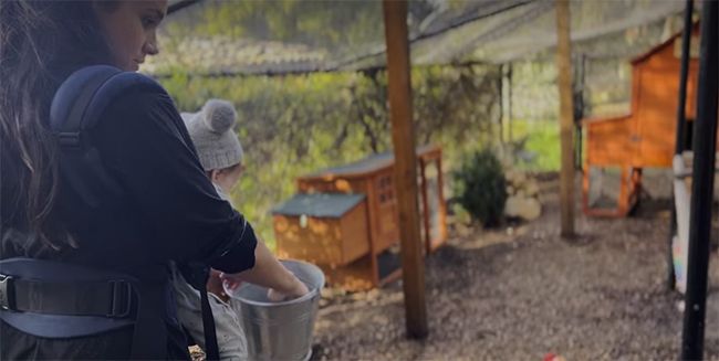 Meghan Markle feeding her chickens with baby Lili in Montecito