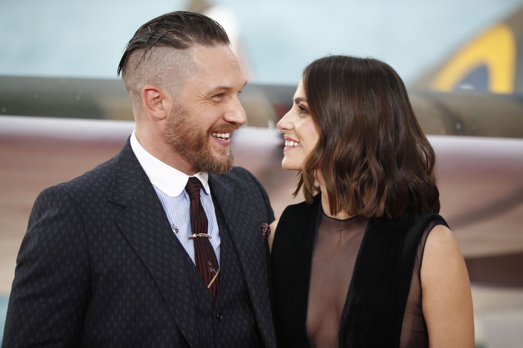 British actor Tom Hardy and his wife Charlotte Riley pose for a photograph upon arrival for the world premiere of Dunkirk