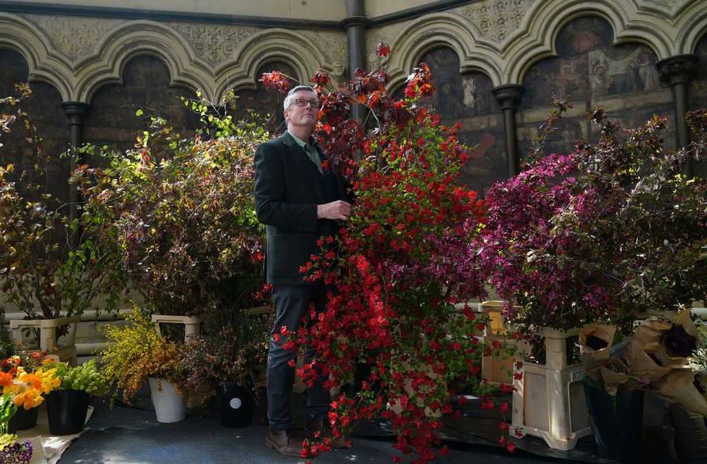 Shane Connolly arranging the coronation service flowers inside Chapter House in Westminster Abbey