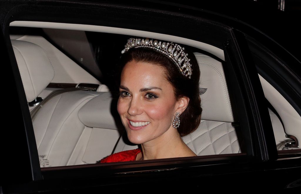 Kate Middleton, the Princess of Wales, wearing a tiara departs after attending the annual Diplomatic Reception at Buckingham Palace on December 8, 2016 in London, England. 