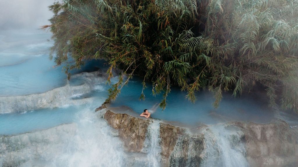 A woman at the Cascate del Mulino hot springs