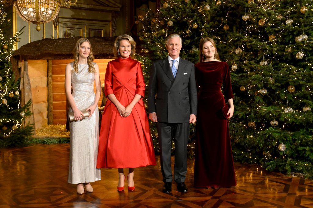 The Belgian royals posed for pictures in front of the Christmas trees