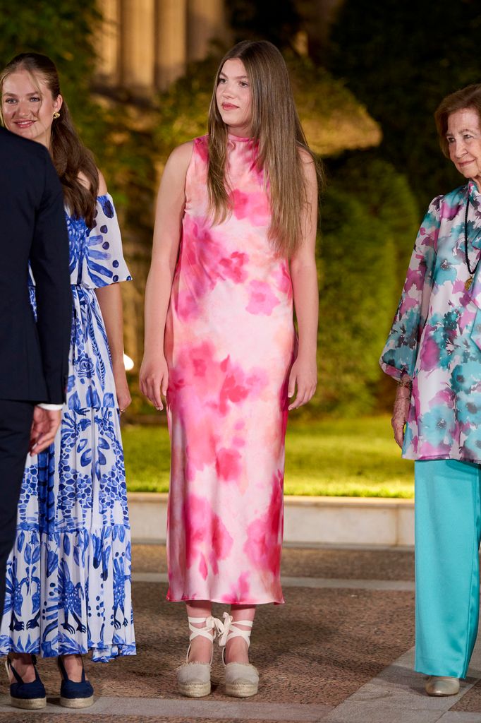 Princess Sofia in tie dye dress beside sister