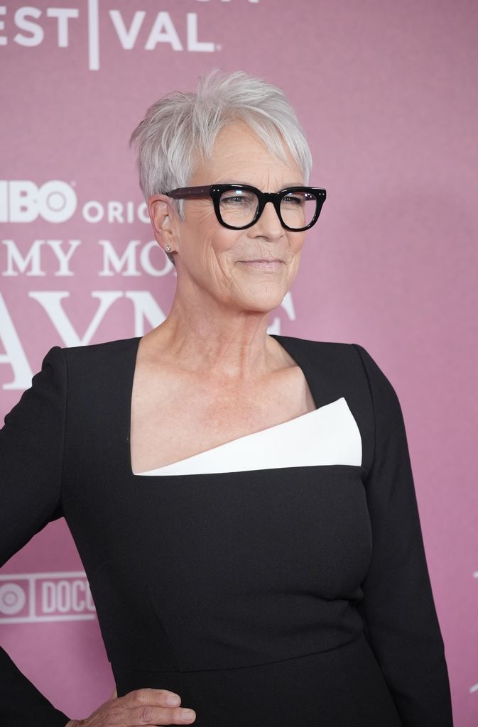 Jamie Lee Curtis in black dress and glasses