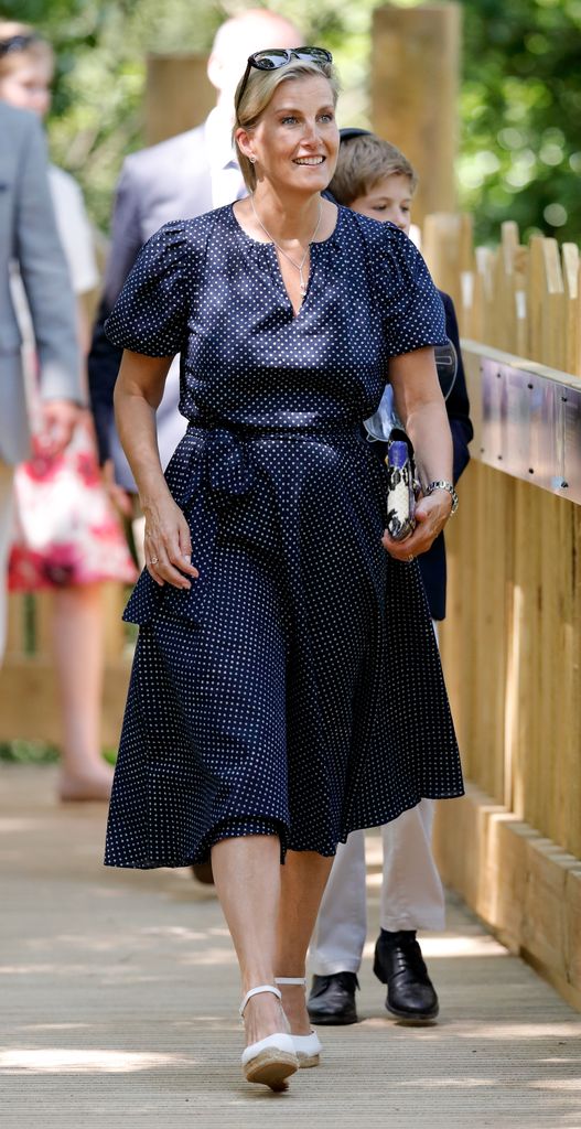 Sophie in navy and white dotty dress