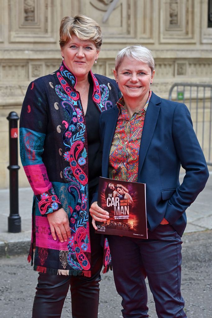 Two women posing for camera
