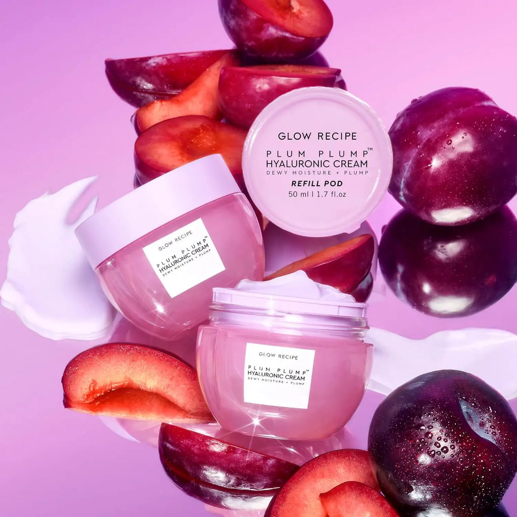Stock image showing Glow Recipe Plum Plump Hyaluronic Cream and plum fruits