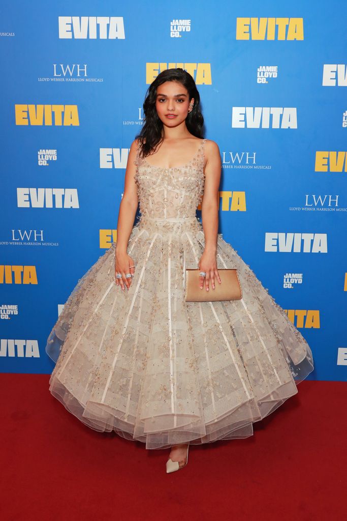 Rachel Zegler posed on red carpet in beige ball gown