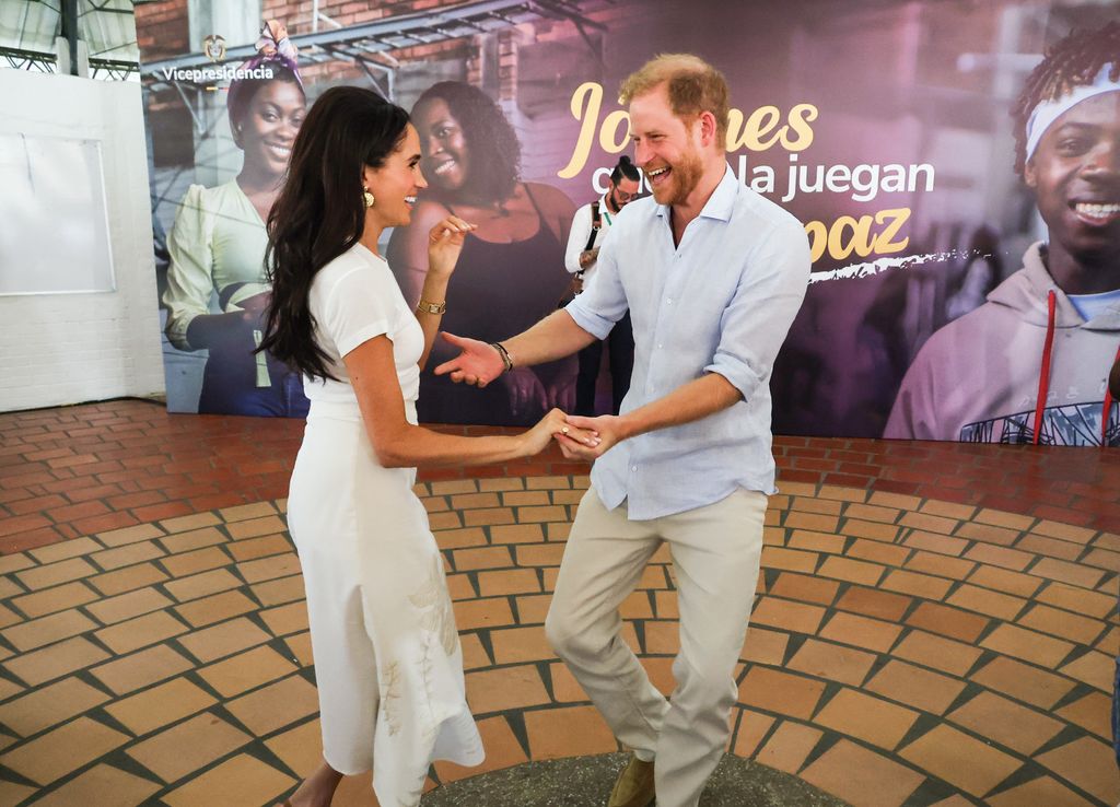 Meghan Markle and Prince Harry dancing in Colombia