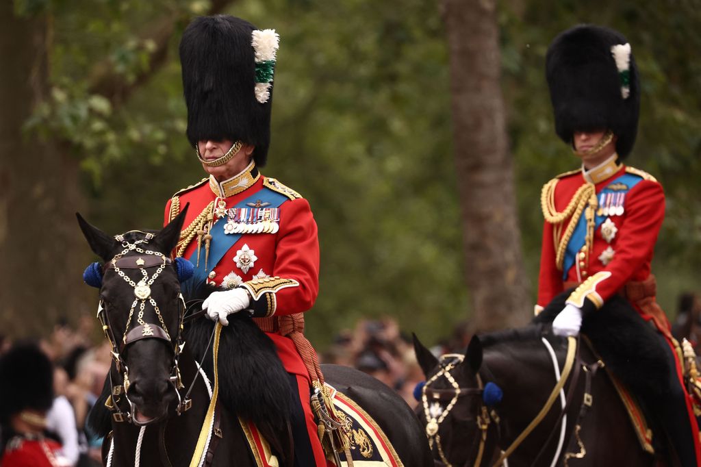 King Charles and Prince William ride their horses as they parade down The Mall at Trooping the Colour