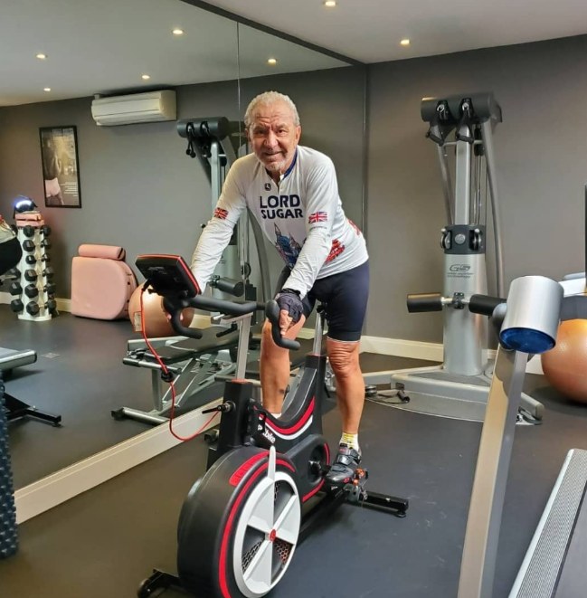 man riding an exercise bike in home gym