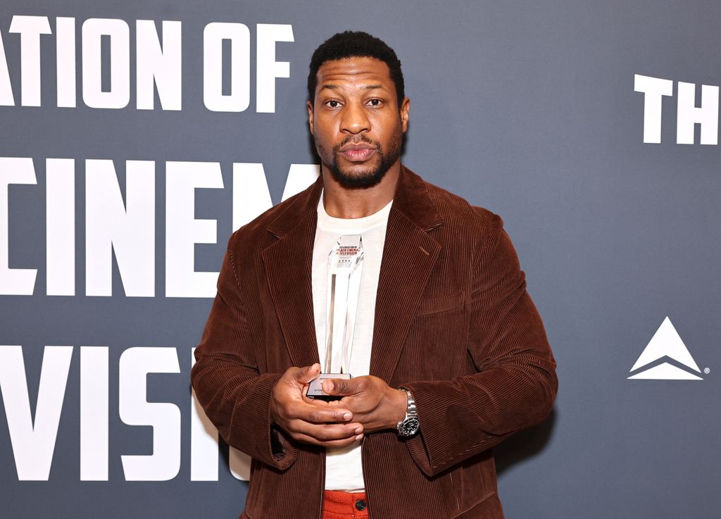 Jonathan Majors poses with the "Actor Award for Film" in the press room during Critics Choice Association's 5th Annual Celebration Of Black Cinema & Television at Fairmont Century Plaza in 2022