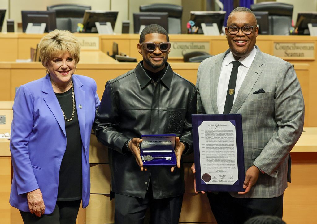 Las Vegas Mayor Carolyn Goodman, Usher and Las Vegas City Councilman Cedric Crear pose during a ceremony honoring Usher at Las Vegas City Hall on October 17, 2023 in Las Vegas, Nevada. Usher was given a proclamation and a ceremonial key to Las Vegas for his work in the local community, his "My Way" residency at Park MGM, and for his upcoming performance at halftime of Super Bowl LVIII at Allegiant Stadium in Las Vegas