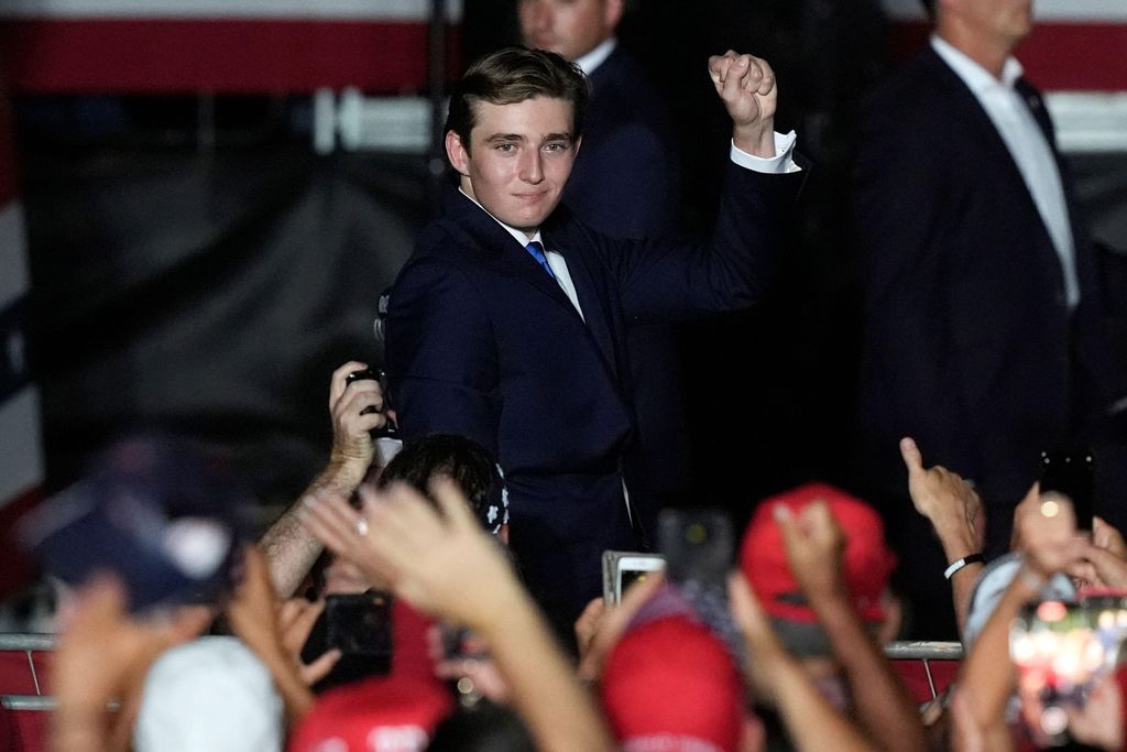Barron Trump gestures after his father Republican presidential candidate former President Donald Trump introduced him during a campaign rally in Florida