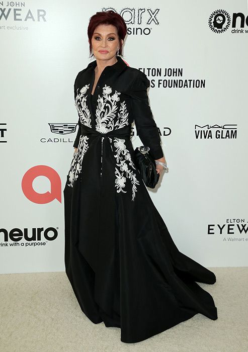 Sharon Osbourne attending Elton Johns event in a gown