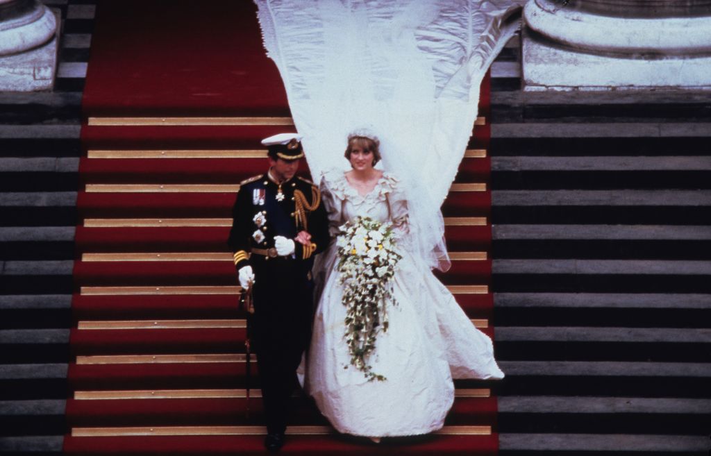 Prince Charles and Princess Diana walking down the stairs at St. Paul's Cathedral following their wedding on July 29, 1981 