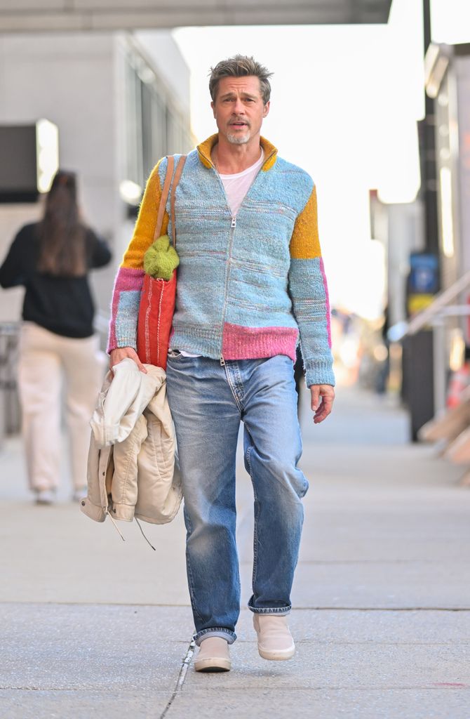 Brad Pitt is seen on the set of "Wolves" in the Financial District in colourful knit