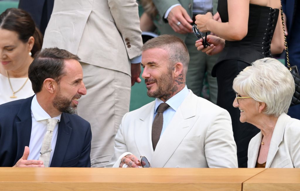 David Beckham and Sandra Beckham talking with Gareth Southgate in royal box at wimbledon