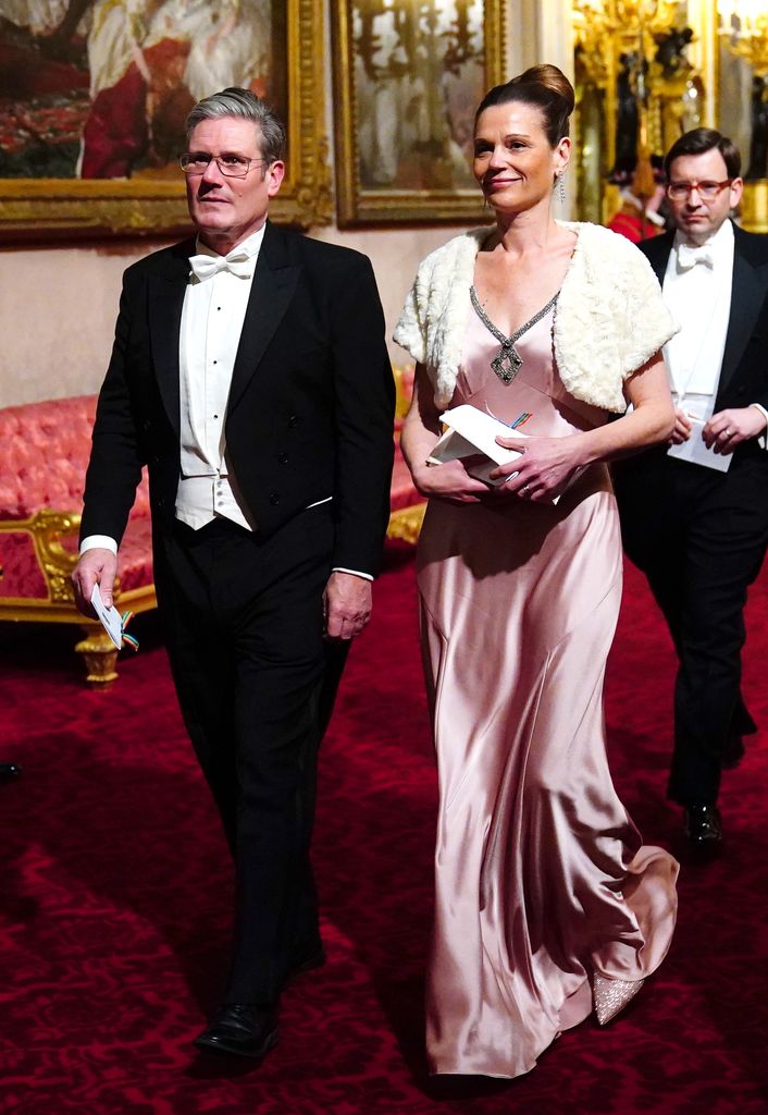 Keir Starmer in a tux with his wife Victoria in a pink silk dress