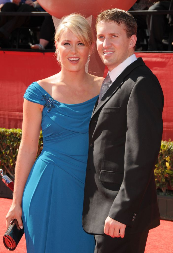 Lindsey Vonn in blue dress and Thomas Vonn in suit